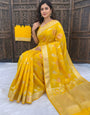 Staring Yellow Banarasi Dola Silk Saree With Gossamer Blouse Piece