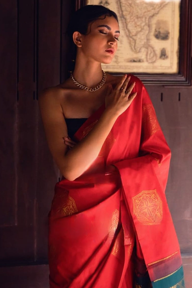 Symmetrical Red Soft Silk Saree With Beguiling Blouse Piece