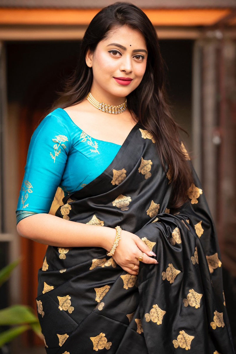 Elaborate Black and Firozi Soft Silk Saree With Piquant Blouse Piece