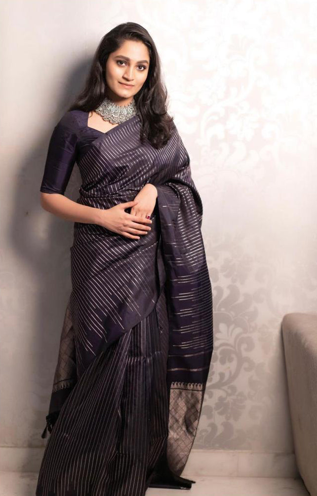 Surpassing Black Soft Silk Saree With Stunning Blouse Piece