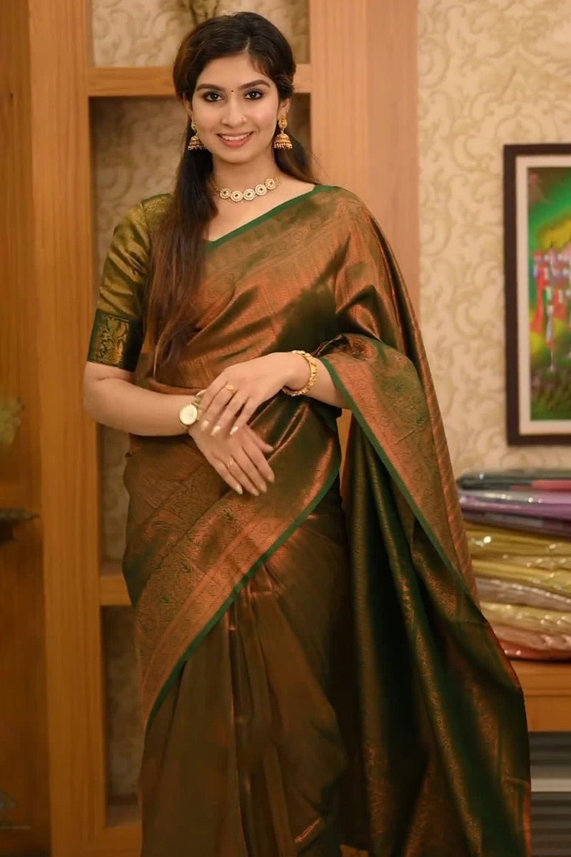 Staggering Dark Green Soft Silk Saree With Confounding Blouse Piece