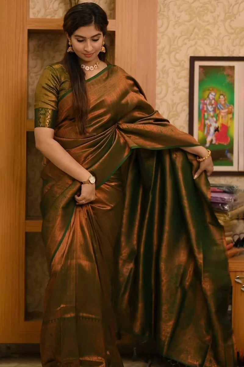 Staggering Dark Green Soft Silk Saree With Confounding Blouse Piece