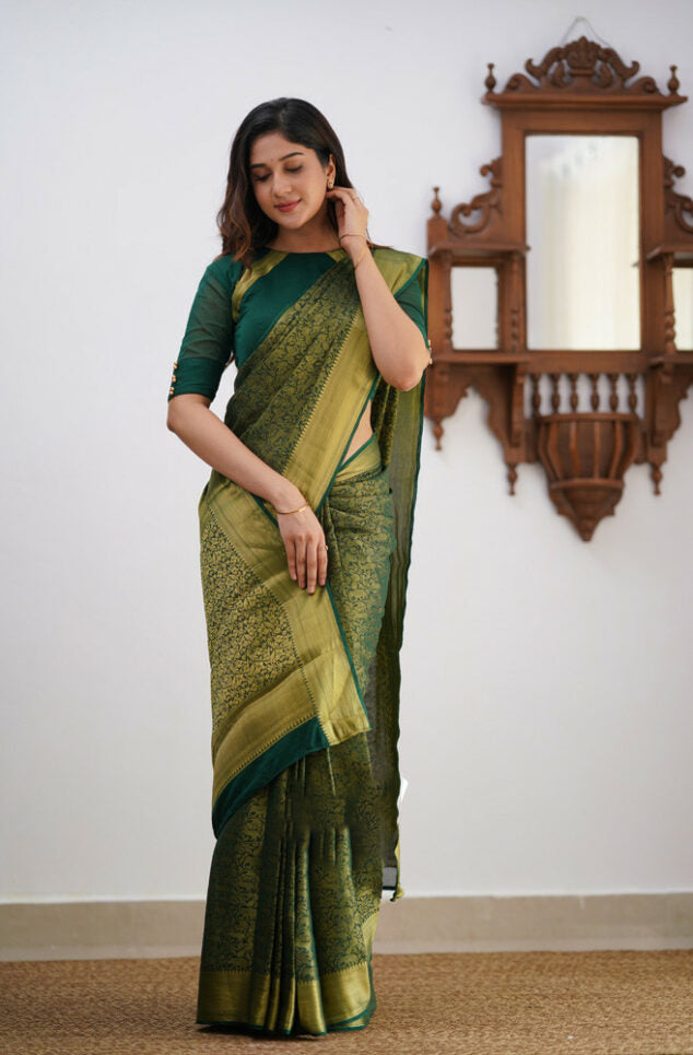 Desiring Dark Green Soft Silk Saree With Resonant Blouse Piece