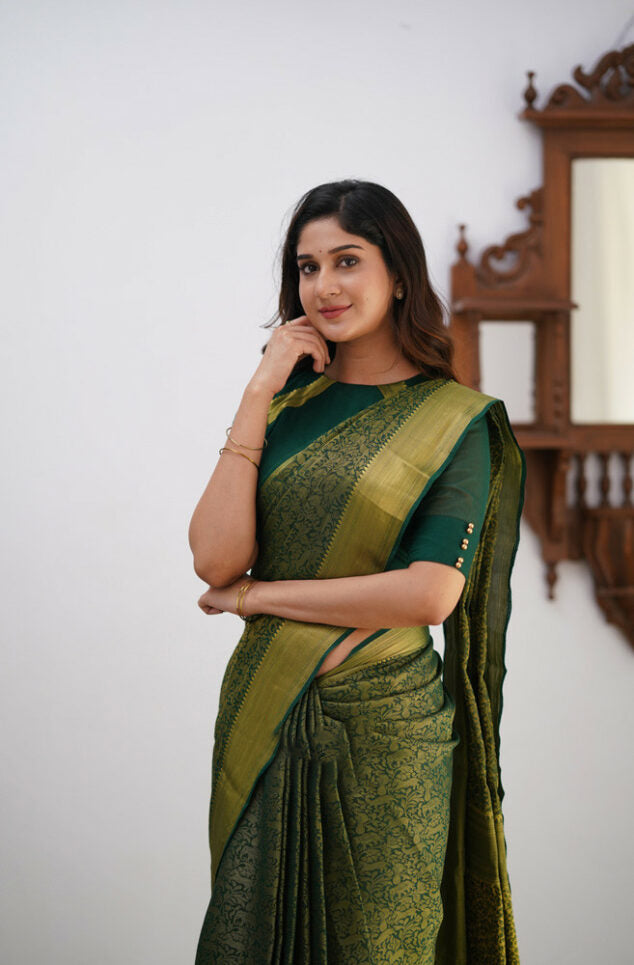 Desiring Dark Green Soft Silk Saree With Resonant Blouse Piece