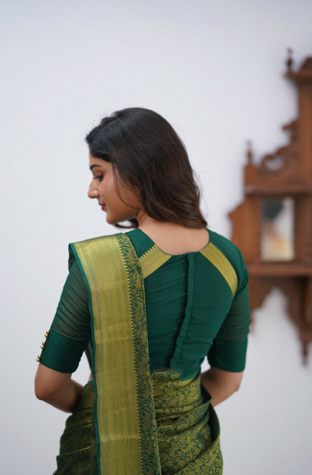 Desiring Dark Green Soft Silk Saree With Resonant Blouse Piece