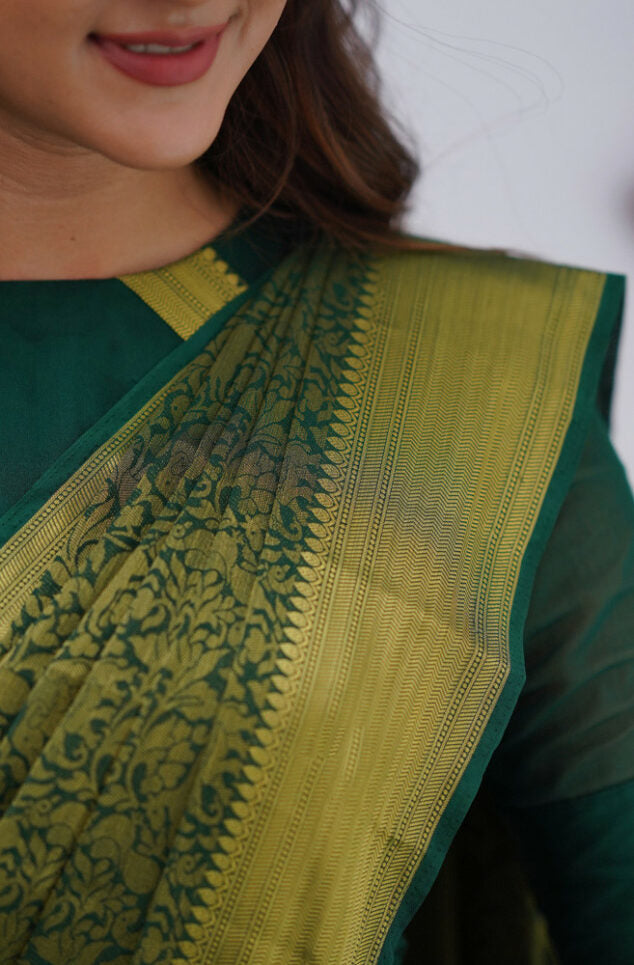 Desiring Dark Green Soft Silk Saree With Resonant Blouse Piece