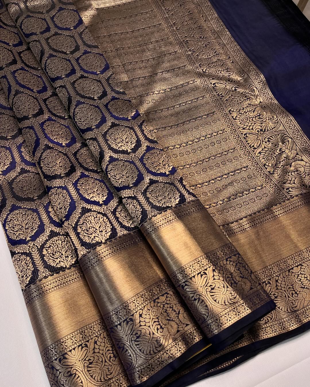 Sonorous Navy Blue Soft Banarasi Silk Saree With Cynosure Blouse Piece