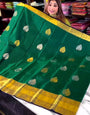 Cynosure Dark Green Soft Banarasi Silk Saree With Enchanting Blouse Piece