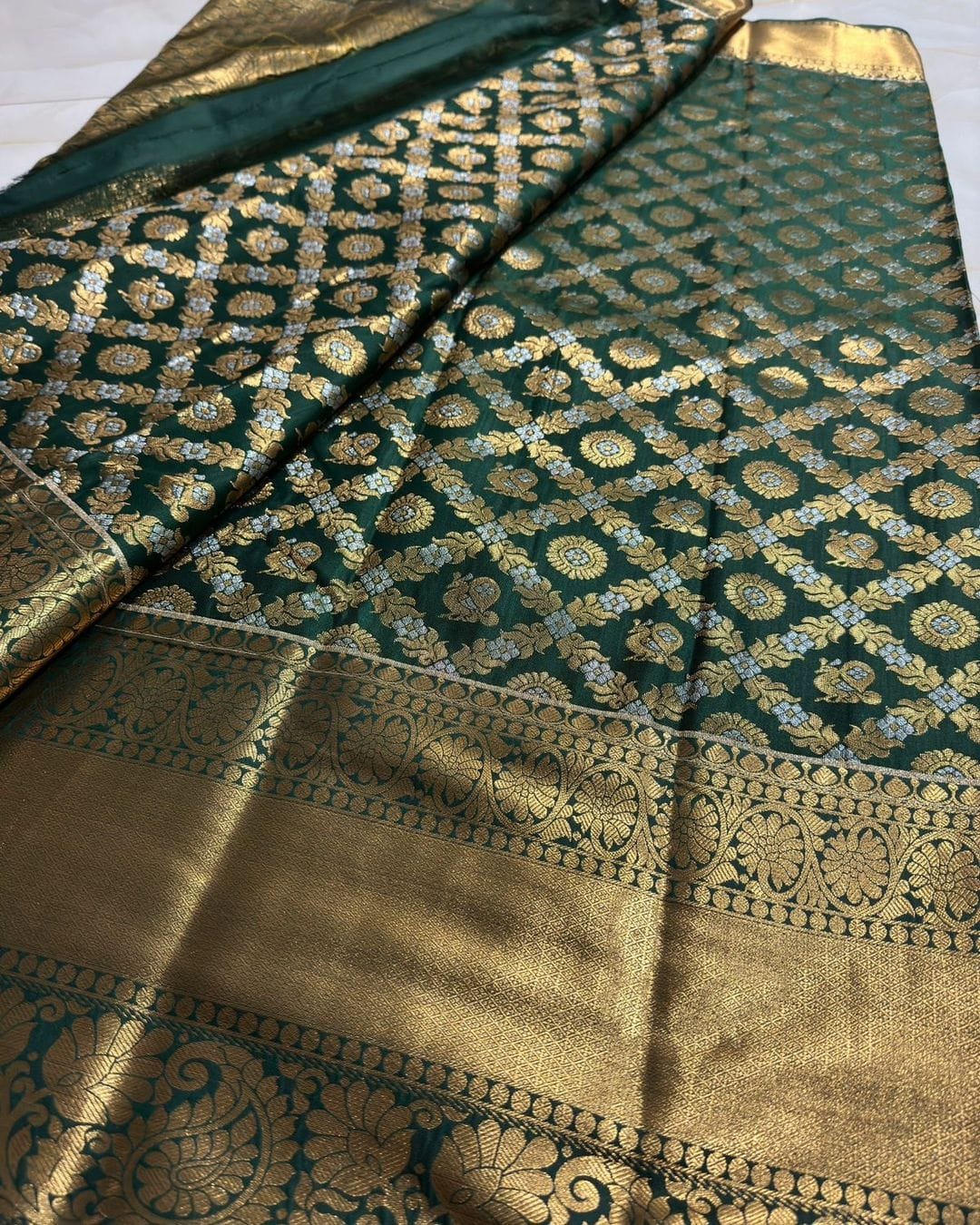 Gorgeous Dark Green Soft Silk Saree With Eye-catching Blouse Piece