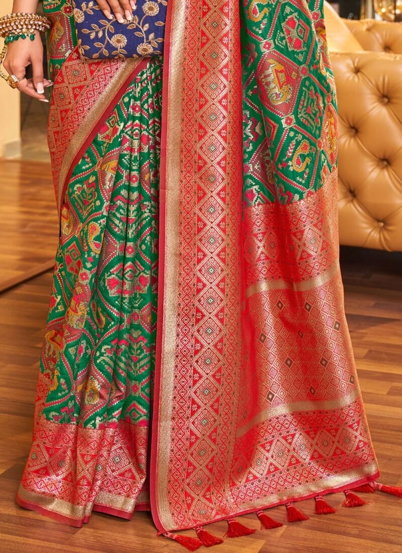 Snazzy Dark Green Patola Silk Saree With Beguiling Blouse Piece