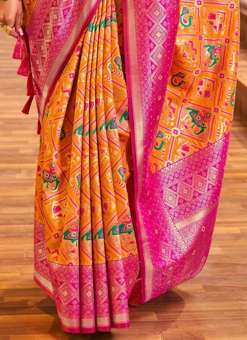 Snappy Orange Patola Silk Saree With Captivating Blouse Piece