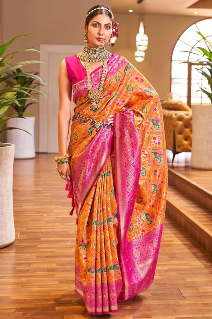 Snappy Orange Patola Silk Saree With Captivating Blouse Piece