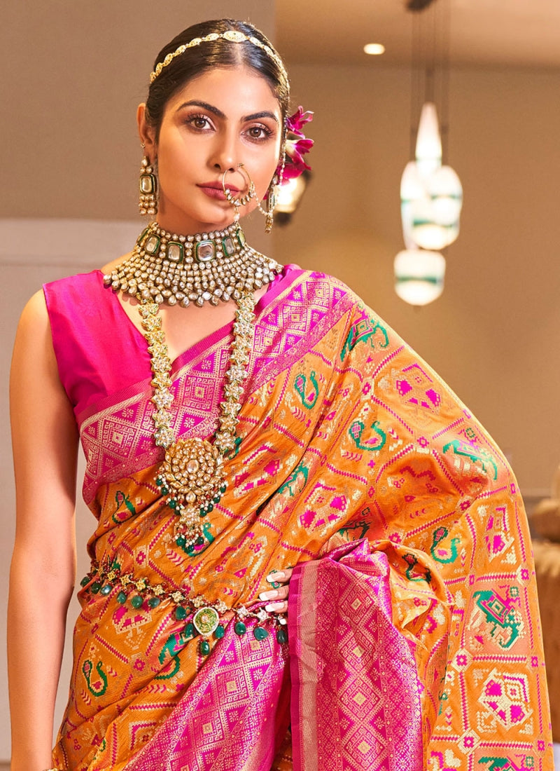 Snappy Orange Patola Silk Saree With Captivating Blouse Piece