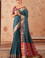 Embellished Rama Patola Silk Saree with Bewitching Blouse Piece