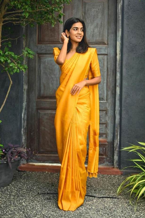 Proficient Yellow Soft Silk Saree With Gossamer Blouse Piece