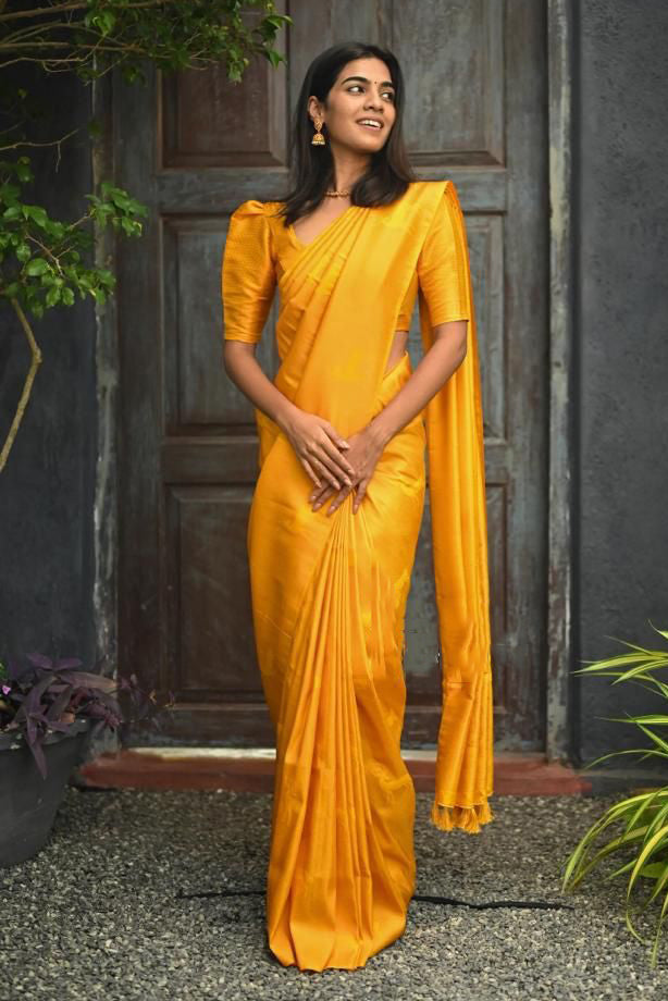 Proficient Yellow Soft Silk Saree With Gossamer Blouse Piece