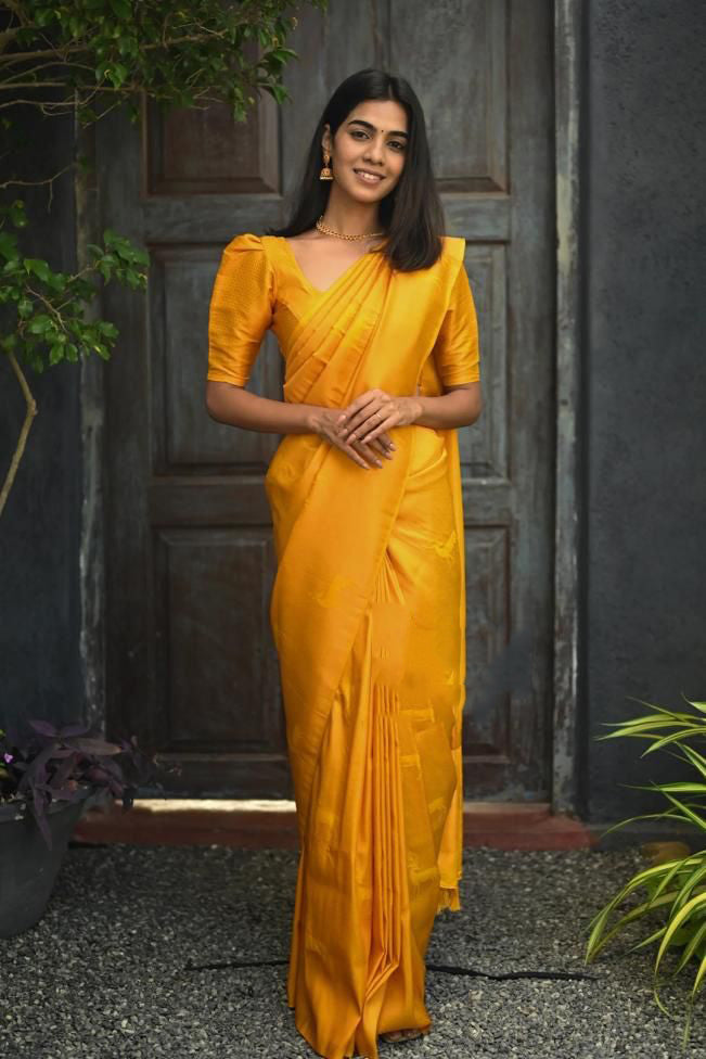 Proficient Yellow Soft Silk Saree With Gossamer Blouse Piece