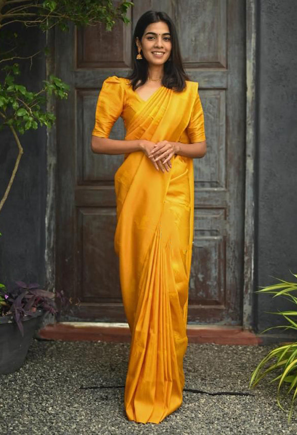 Proficient Yellow Soft Silk Saree With Gossamer Blouse Piece