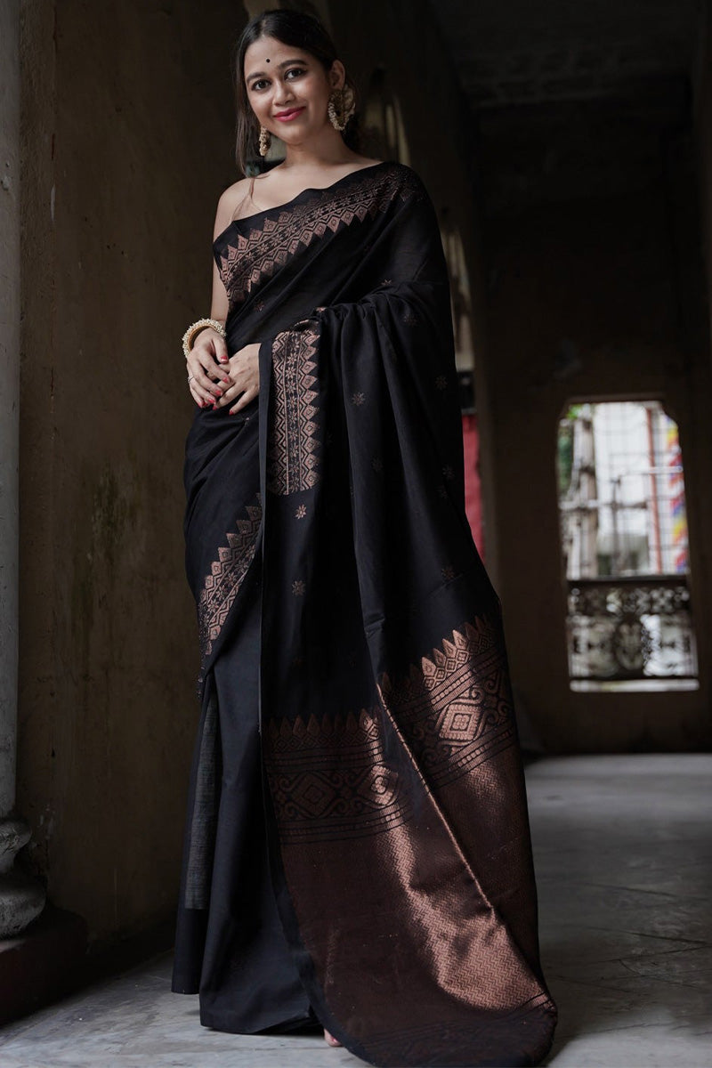 Embrocation Black Soft Silk Saree With Jazzy Blouse Piece