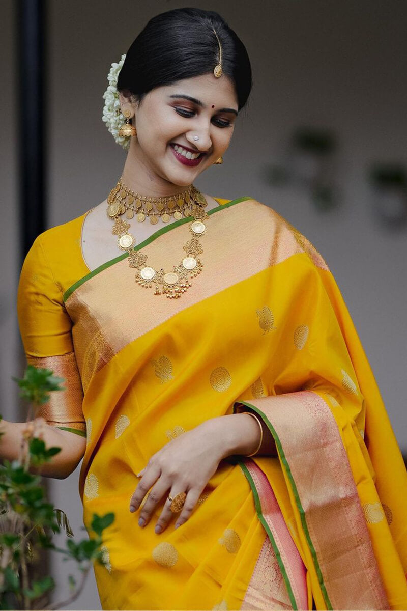 Stunner Yellow Soft Silk Saree With Radiant Blouse Piece