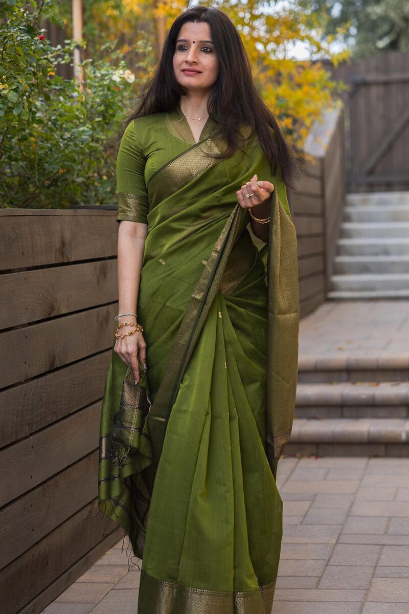 Flattering Green Cotton Silk Saree With Prominent Blouse Piece