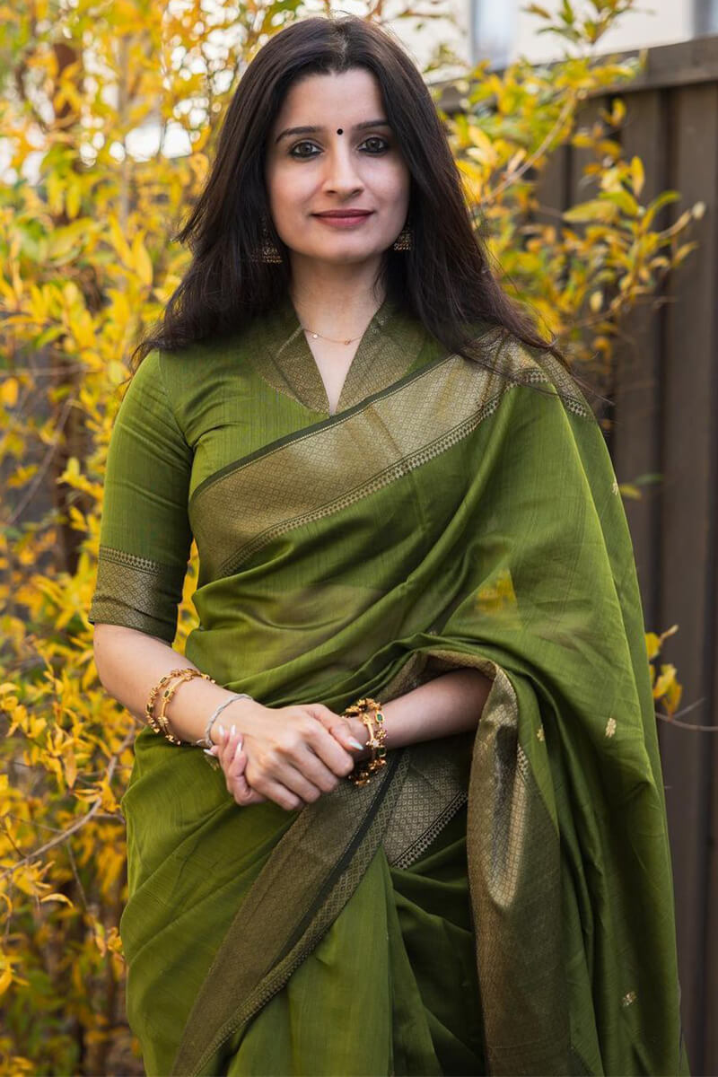 Flattering Green Cotton Silk Saree With Prominent Blouse Piece