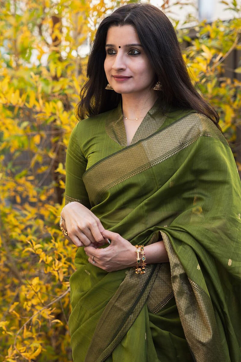 Flattering Green Cotton Silk Saree With Prominent Blouse Piece