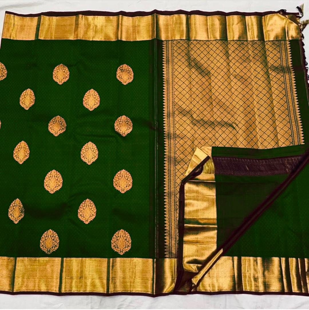 Ephemeral Dark Green Soft Banarasi Silk Saree With Mesmerising Blouse Piece