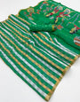 Engrossing Dark Green Printed Cotton Silk Saree With Prettiest Blouse Piece