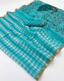 Embrocation Firozi Printed Cotton Silk Saree With Mellifluous Blouse Piece