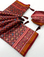 Scintillating Wine Printed Patola Handloom Silk Saree With Demanding Blouse Piece