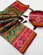 Ornate Green Printed Patola Handloom Silk Saree With Angelic Blouse Piece