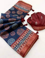 Denouement Navy Blue Ajrakh Printed Soft Silk Saree With Desirable Blouse Piece
