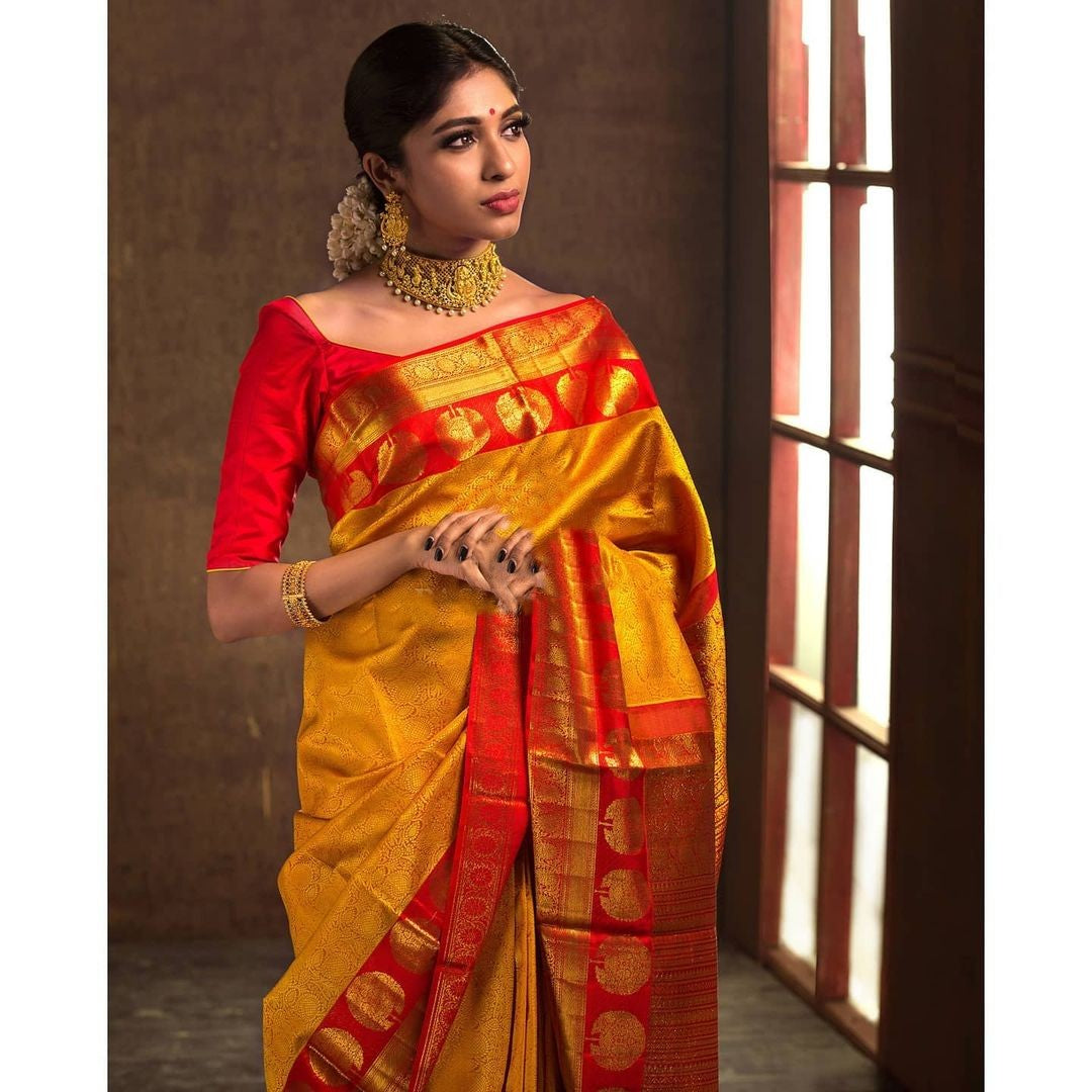 Phenomenal Yellow Soft Banarasi Silk Saree With Artistic Blouse Piece