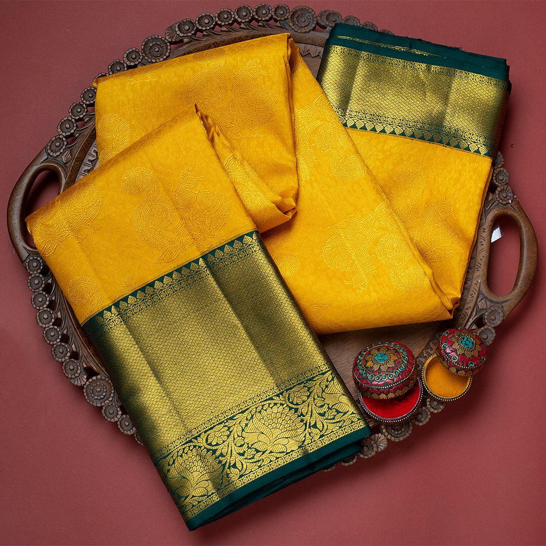 Elision Yellow Soft Banarasi Silk Saree With Resplendent Blouse Piece