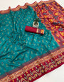 Fugacious Rama Banarasi Ikkat Silk Saree With Moiety Blouse Piece